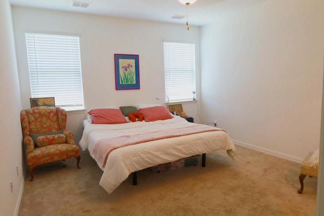 1129 Cropout Way, Fort Worth, TX 76052 - carpeted bedroom featuring multiple windows and baseboards
