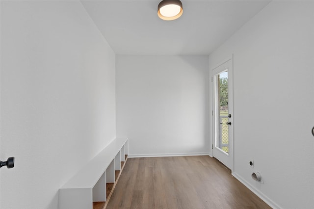 698 County Road 3825, Bridgeport, TX 76458 - mudroom with healthy amount of natural light, wood finished floors, and baseboards