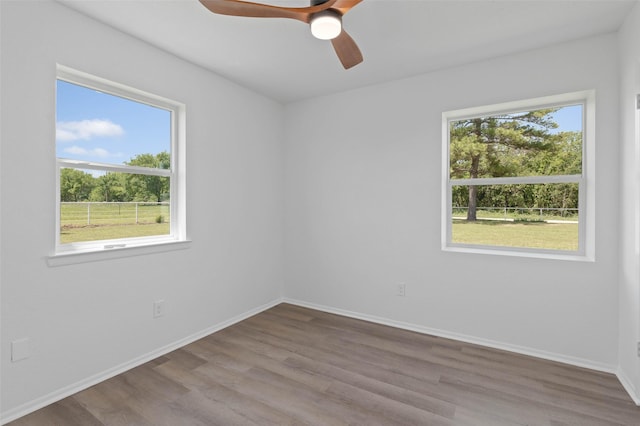 698 County Road 3825, Bridgeport, TX 76458 - unfurnished room with wood finished floors, baseboards, and ceiling fan