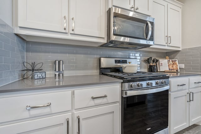 15720 Redgrave Dr, Fort Worth, TX 76247 - kitchen featuring appliances with stainless steel finishes, backsplash, and white cabinets