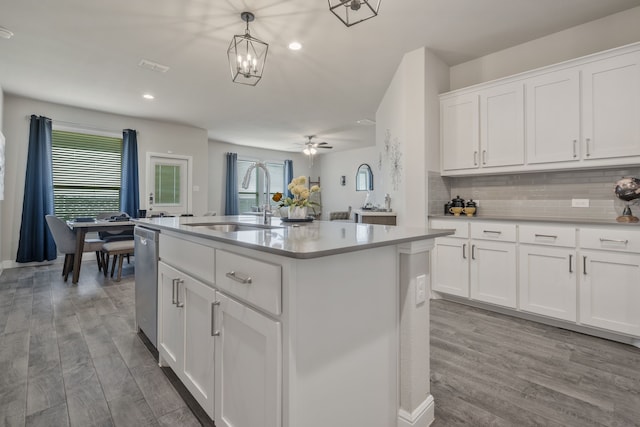 15720 Redgrave Dr, Fort Worth, TX 76247 - kitchen with a sink, wood finished floors, light countertops, tasteful backsplash, and recessed lighting