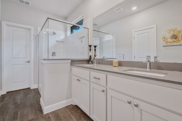 15720 Redgrave Dr, Fort Worth, TX 76247 - full bath with a stall shower, double vanity, wood finished floors, and baseboards