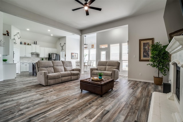 1312 Merrimac Dr, Allen, TX 75002 - living area featuring a ceiling fan, a fireplace, dark wood-style floors, recessed lighting, and high vaulted ceiling