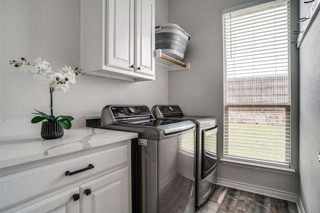 1312 Merrimac Dr, Allen, TX 75002 - clothes washing area featuring cabinet space, washer and clothes dryer, wood finished floors, and baseboards