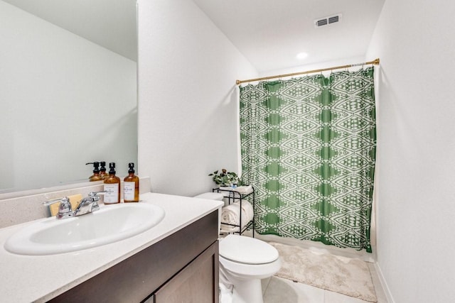 full bathroom featuring toilet, tile patterned flooring, curtained shower, and vanity