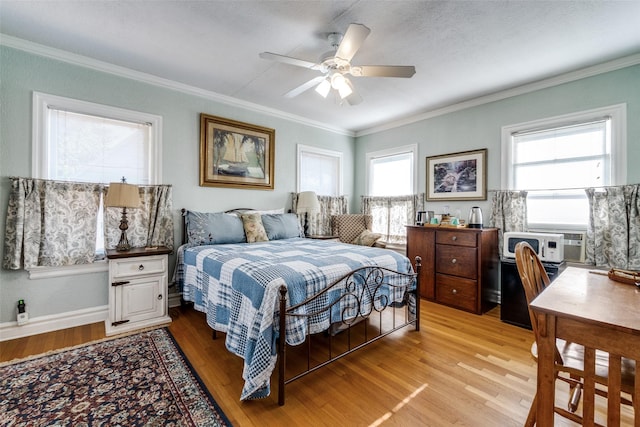 5202 Morningside Ave, Dallas, TX 75206 - bedroom with light wood-type flooring, ornamental molding, a ceiling fan, and an office area