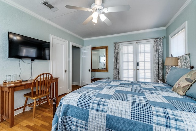 5202 Morningside Ave, Dallas, TX 75206 - bedroom with french doors, crown molding, wood finished floors, baseboards, and a ceiling fan