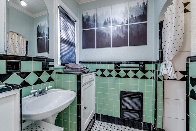 5202 Morningside Ave, Dallas, TX 75206 - bathroom with tile walls, crown molding, a sink, tile patterned flooring, and wainscoting