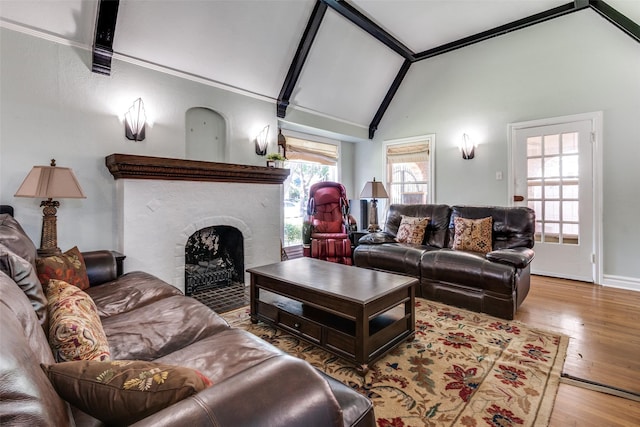 5202 Morningside Ave, Dallas, TX 75206 - living area with lofted ceiling, a fireplace, wood finished floors, and baseboards