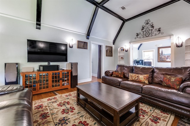 5202 Morningside Ave, Dallas, TX 75206 - living room featuring high vaulted ceiling, wood finished floors, and baseboards