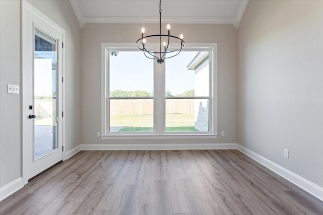 10201 Castleberry Ln, Waco, TX 76712 - unfurnished dining area featuring crown molding, a chandelier, wood finished floors, baseboards, and healthy amount of natural light