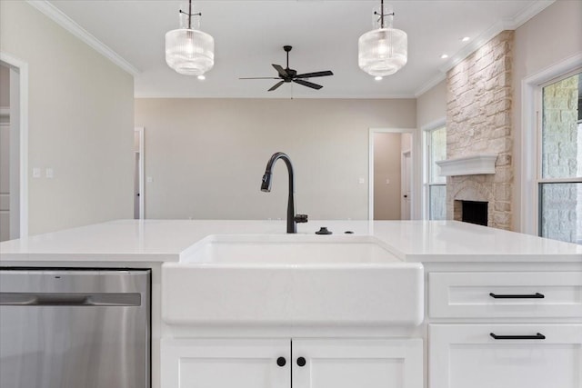 10201 Castleberry Ln, Waco, TX 76712 - kitchen with dishwasher, a sink, a ceiling fan, white cabinetry, and light countertops