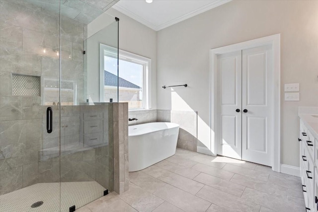 10201 Castleberry Ln, Waco, TX 76712 - full bath featuring crown molding, a shower stall, a soaking tub, vanity, and tile walls
