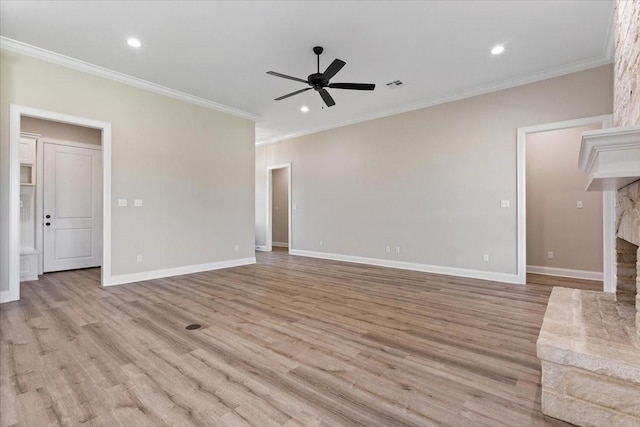 10201 Castleberry Ln, Waco, TX 76712 - unfurnished living room with a ceiling fan, ornamental molding, light wood-style flooring, recessed lighting, and baseboards