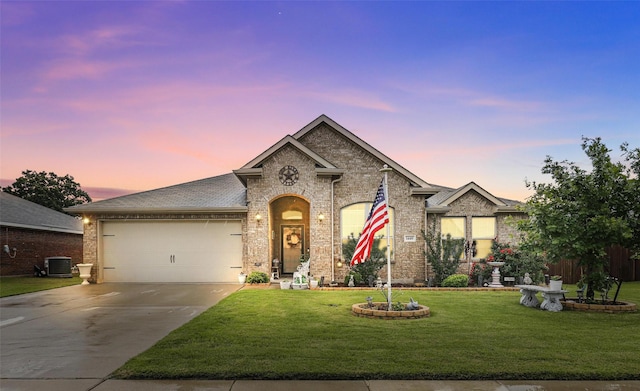1440 Glade Meadows Dr, Burleson, TX 76058 - view of front of house with central air condition unit, a garage, driveway, and a lawn
