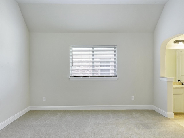 2165 Hidalgo Ln, Frisco, TX 75034 - spare room featuring light carpet, baseboards, and lofted ceiling