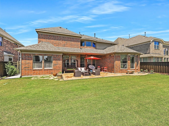 2165 Hidalgo Ln, Frisco, TX 75034 - rear view of house with a patio, brick siding, a shingled roof, and outdoor lounge area