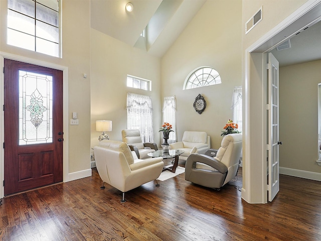 2165 Hidalgo Ln, Frisco, TX 75034 - living area featuring high vaulted ceiling, baseboards, dark wood-style flooring, and healthy amount of natural light