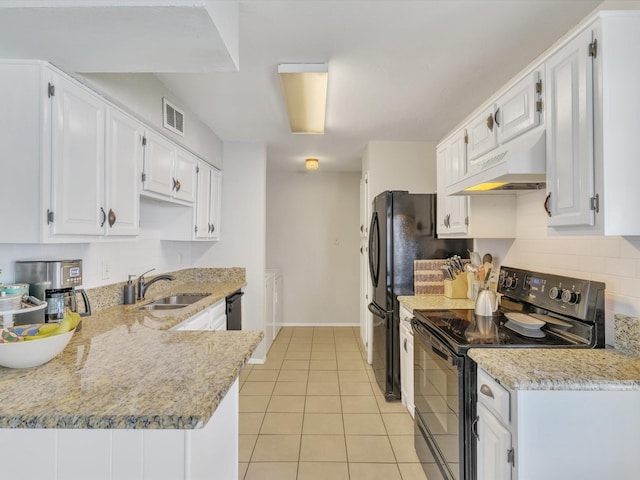 kitchen with black range with electric cooktop, under cabinet range hood, a sink, white cabinetry, and light tile patterned floors