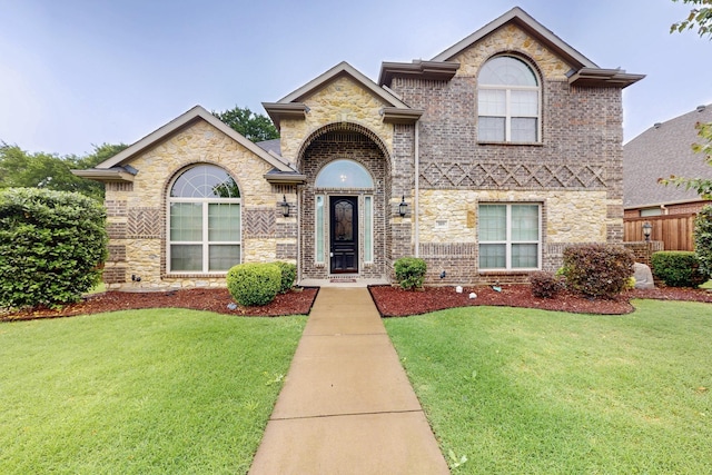 view of front of house with brick siding and stone siding