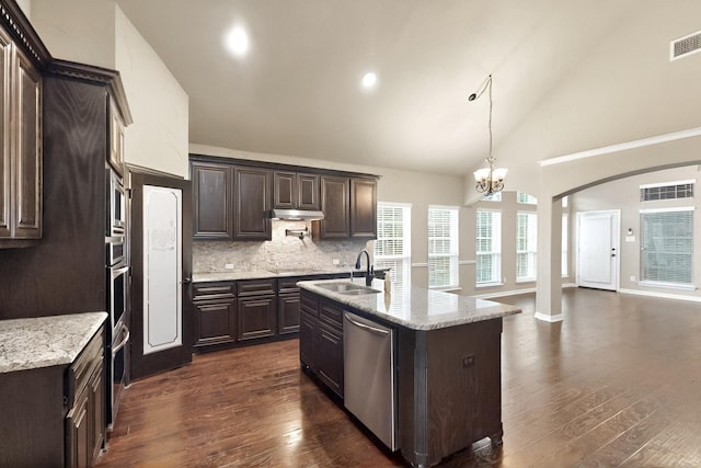 kitchen featuring stainless steel appliances, high vaulted ceiling, dark brown cabinets, dark wood-style flooring, and a sink