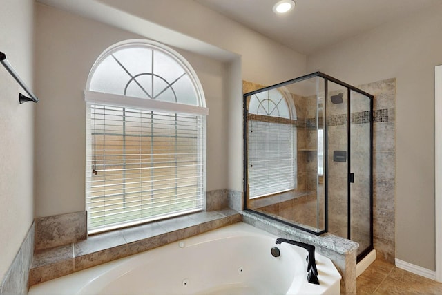 full bath featuring a stall shower and a jetted tub