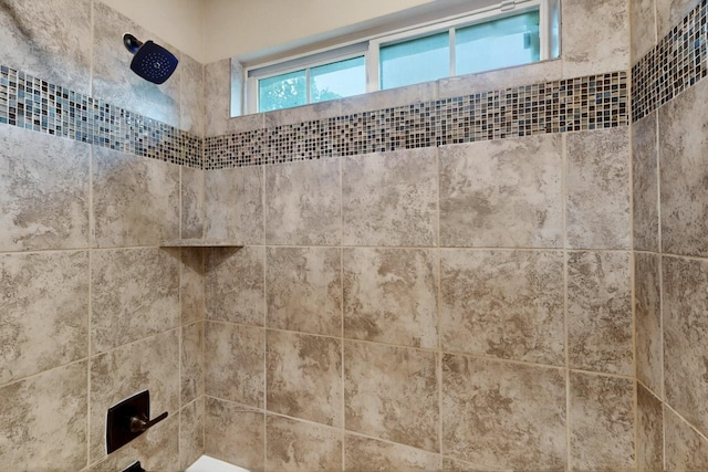 bathroom view of tiled shower