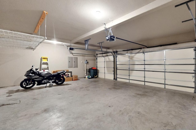garage featuring a garage door opener and electric panel