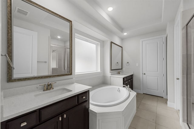 10969 Coastal Violet Rd, Frisco, TX 75035 - bathroom featuring a shower stall, two vanities, tile patterned floors, a garden tub, and recessed lighting