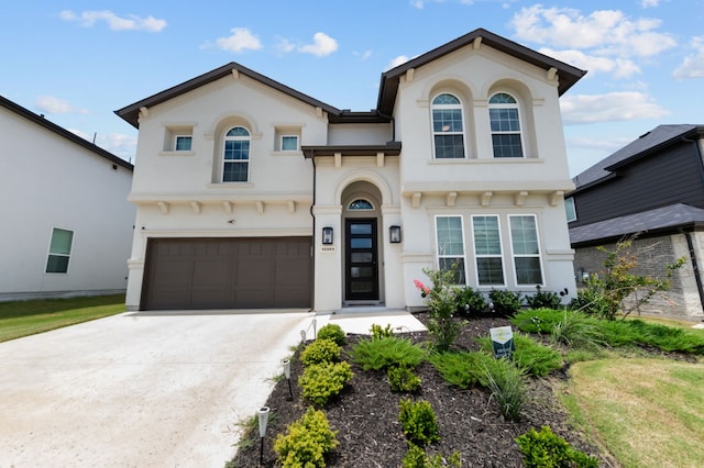 10969 Coastal Violet Rd, Frisco, TX 75035 - view of front of house with a garage, concrete driveway, and stucco siding