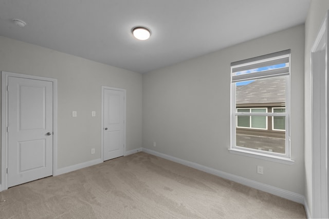 10969 Coastal Violet Rd, Frisco, TX 75035 - unfurnished bedroom featuring light carpet and baseboards