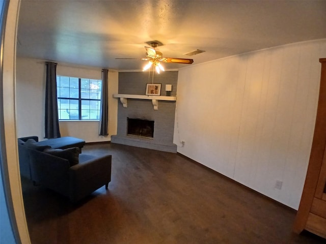 3304 Gorton Rd, Shreveport, LA 71119 - living area with a ceiling fan, a fireplace, and dark wood-style flooring