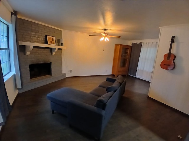 3304 Gorton Rd, Shreveport, LA 71119 - living room featuring a ceiling fan, a fireplace, and dark wood-style floors