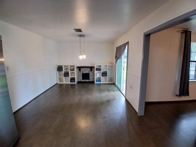 3304 Gorton Rd, Shreveport, LA 71119 - unfurnished living room featuring dark wood finished floors and a fireplace