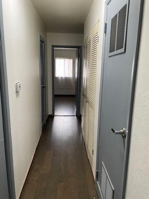 hall with dark wood finished floors
