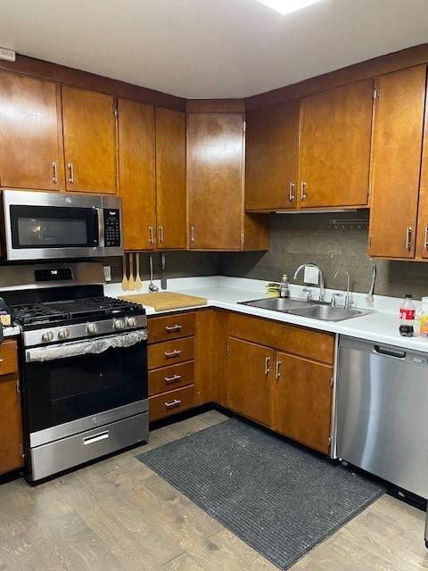 3304 Gorton Rd, Shreveport, LA 71119 - kitchen with appliances with stainless steel finishes, a sink, and brown cabinetry
