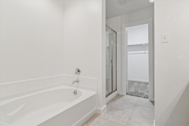 1706 Long Meadow Rd, Wylie, TX 75098 - full bath with a shower stall, a garden tub, tile patterned flooring, and a walk in closet