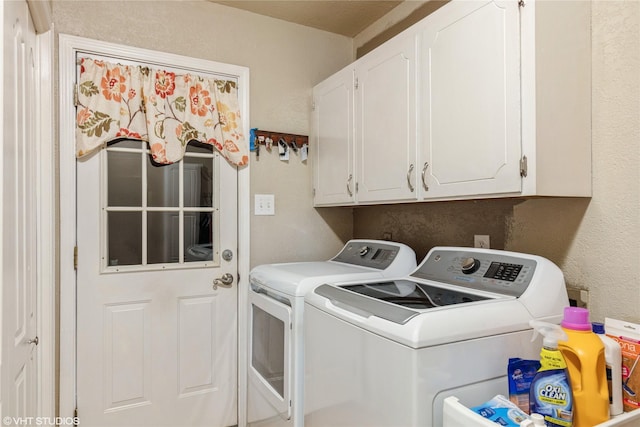 5920 Retta Mansfield Rd, Burleson, TX 76028 - laundry room with washer and dryer, cabinet space, and a textured wall