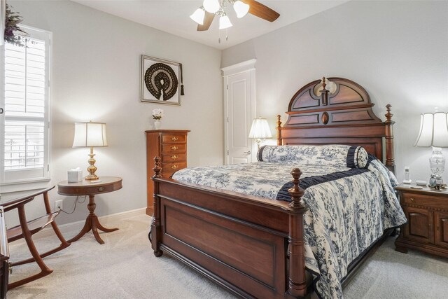 517 Hearth Ter, Argyle, TX 76226 - bedroom with light carpet, multiple windows, baseboards, and ceiling fan