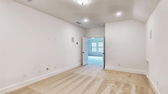 unfurnished room with light carpet, baseboards, and recessed lighting