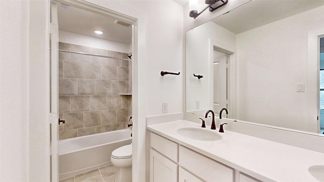 bathroom with toilet, double vanity, tub / shower combination, and tile patterned floors