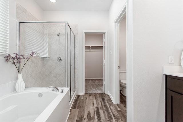2148 Miramar Dr, Little Elm, TX 75068 - full bath with a shower stall, a garden tub, wood finished floors, and a walk in closet