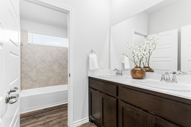 2148 Miramar Dr, Little Elm, TX 75068 - full bath featuring wood finished floors, double vanity, and shower / bathtub combination
