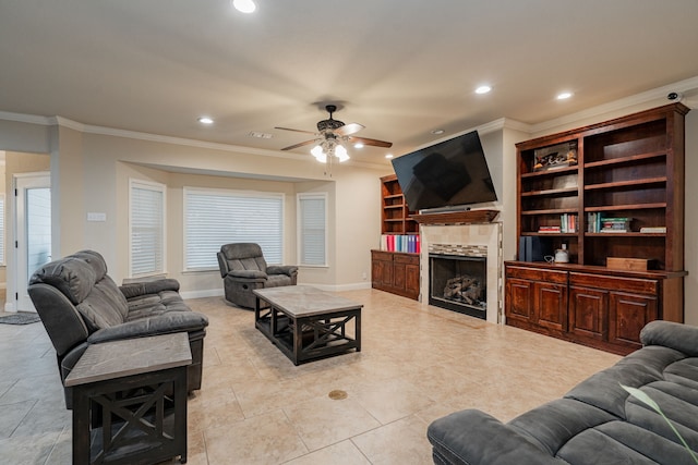 2687 Mcclendon Rd, Weatherford, TX 76088 - living room featuring crown molding, a ceiling fan, recessed lighting, a tile fireplace, and light tile patterned floors