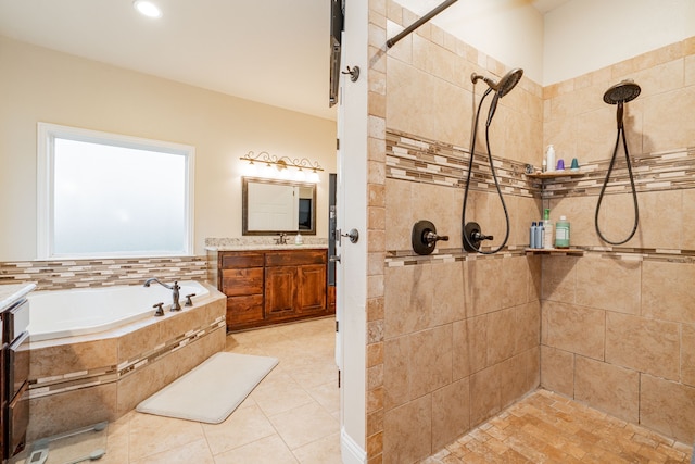 2687 Mcclendon Rd, Weatherford, TX 76088 - full bathroom featuring vanity, tiled shower, a garden tub, and tile patterned floors