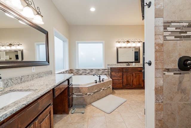 2687 Mcclendon Rd, Weatherford, TX 76088 - full bathroom featuring two vanities, a bath, tiled shower, tile patterned flooring, and recessed lighting
