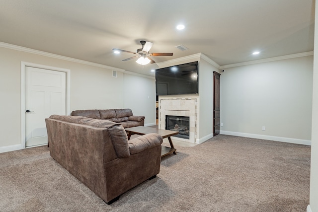 2687 Mcclendon Rd, Weatherford, TX 76088 - living room with a ceiling fan, crown molding, a tile fireplace, carpet floors, and recessed lighting