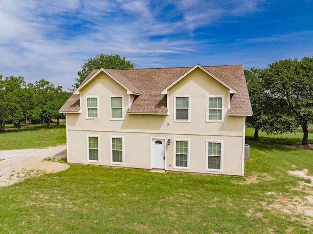 2687 Mcclendon Rd, Weatherford, TX 76088 - view of front of property with a shingled roof, a front yard, and stucco siding