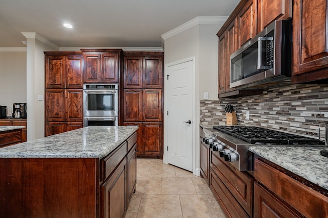 2687 Mcclendon Rd, Weatherford, TX 76088 - kitchen with stainless steel appliances, crown molding, backsplash, light stone countertops, and recessed lighting