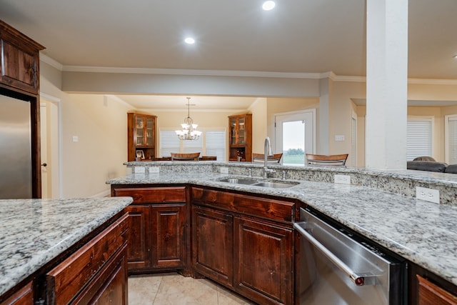 2687 Mcclendon Rd, Weatherford, TX 76088 - kitchen with appliances with stainless steel finishes, ornamental molding, light stone counters, hanging light fixtures, and a chandelier